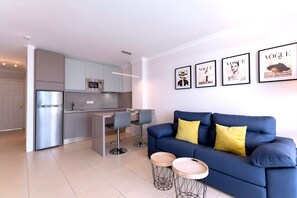 Apartment, Ensuite, Pool View (Apartment-0) | Living area | 30-inch LED TV with satellite channels - Moon Dunes Apartment (San Bartolomé de Tirajana)
