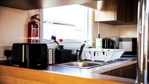 Cabin | Private kitchen | Fridge, microwave, oven, stovetop