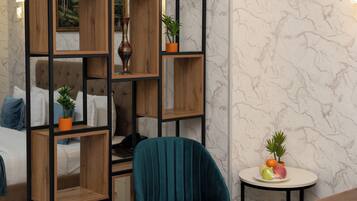 Deluxe Double Room | Living area | 43-inch flat-screen TV with digital channels, TV, heated floors