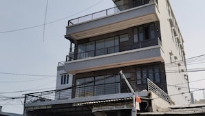 A multi-story building with a commercial ground floor. - The Vinci Hotel powered by Cocotel (Jakarta)