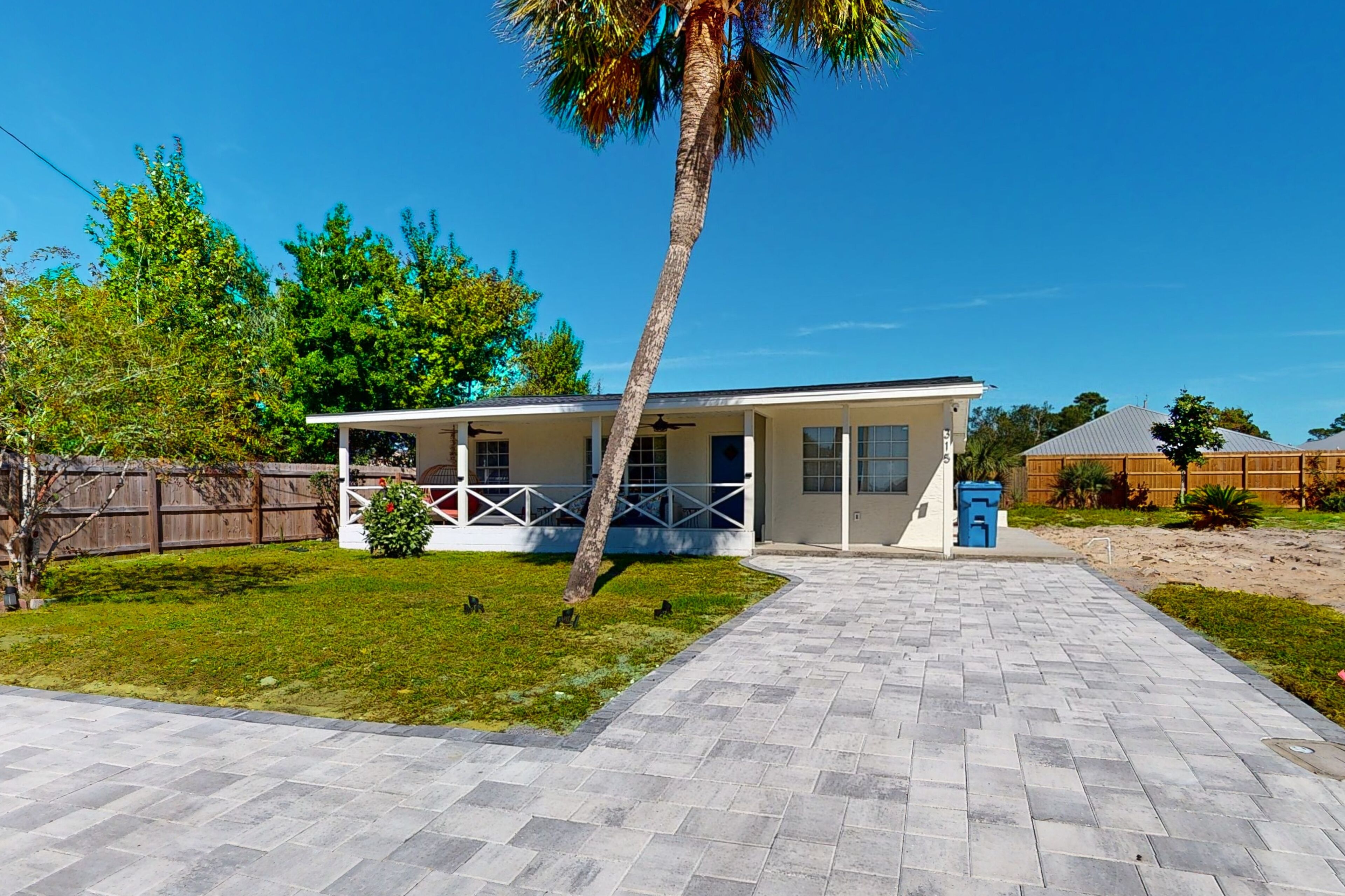 Renovated beach home with covered porch, sunroom, W/D, & AC - dog-friendly