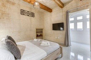 1 bedroom, desk, iron/ironing board, travel crib