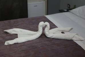 Premium bedding, down duvets, memory-foam beds, desk