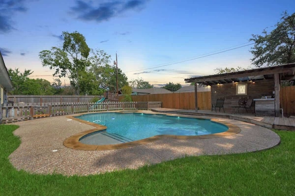 Enjoy an evening sunset in your private backyard oasis. The large pool, covered patio, & kids play area make this the perfect space for some outdoor family fun!