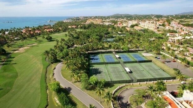 A golf course with a tennis court and a road curving through it. - Seaside, Tennis, Pickleball, Golf, Pool (Humacao)