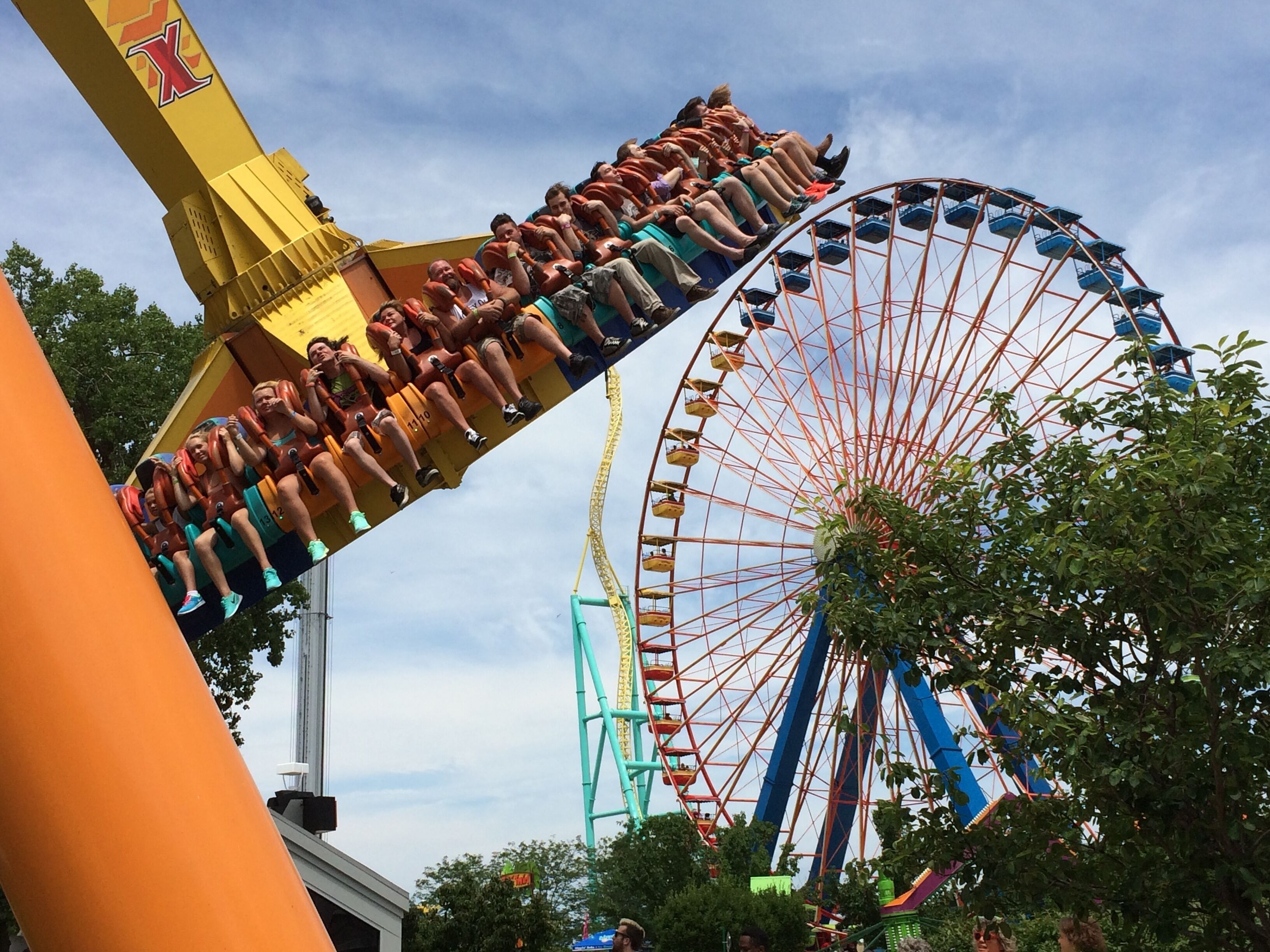 A roller coaster with a large wheel and a steep drop.