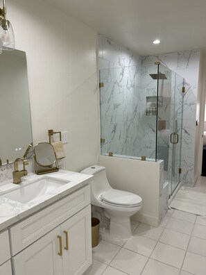Shower, hair dryer, towels, soap