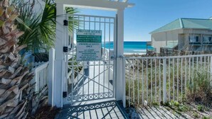 A gated entrance to a private area with a sign indicating it is for owners and guests only.