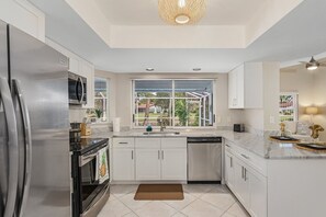 Fridge, microwave, oven, stovetop - Naples Golf Front Luxe Home, Htd Pool, Golf Available at Quail Run (Naples)