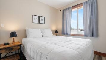 1 bedroom, desk, iron/ironing board, travel crib