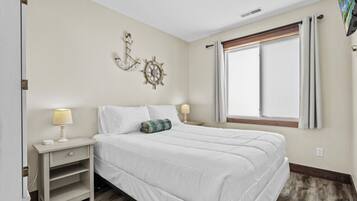 1 bedroom, desk, iron/ironing board, travel crib