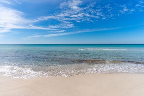 A beach with clear water and a sandy shore. - Vacation Home "Villa Stella" with Private Terraces & Private Garden (alezio)