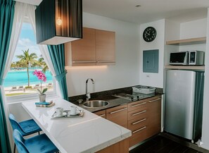 Fridge, microwave, coffee/tea maker, cookware/dishes/utensils