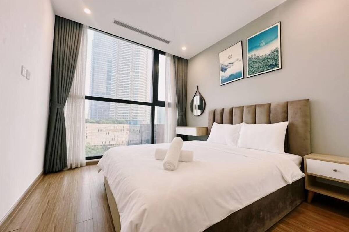 Premium bedding, desk, laptop workspace, iron/ironing board