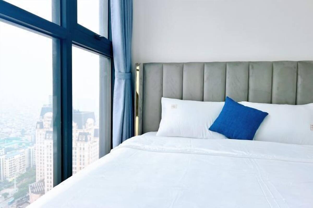 Premium bedding, desk, laptop workspace, iron/ironing board