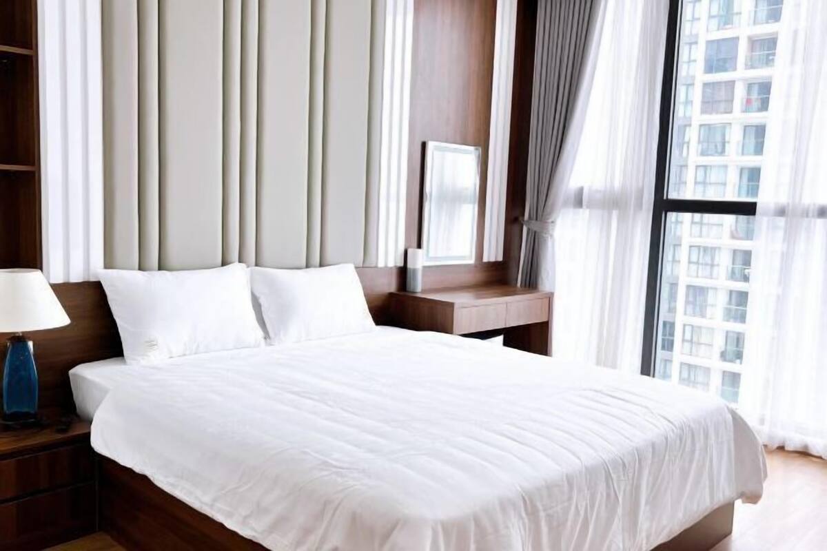 Premium bedding, desk, laptop workspace, iron/ironing board