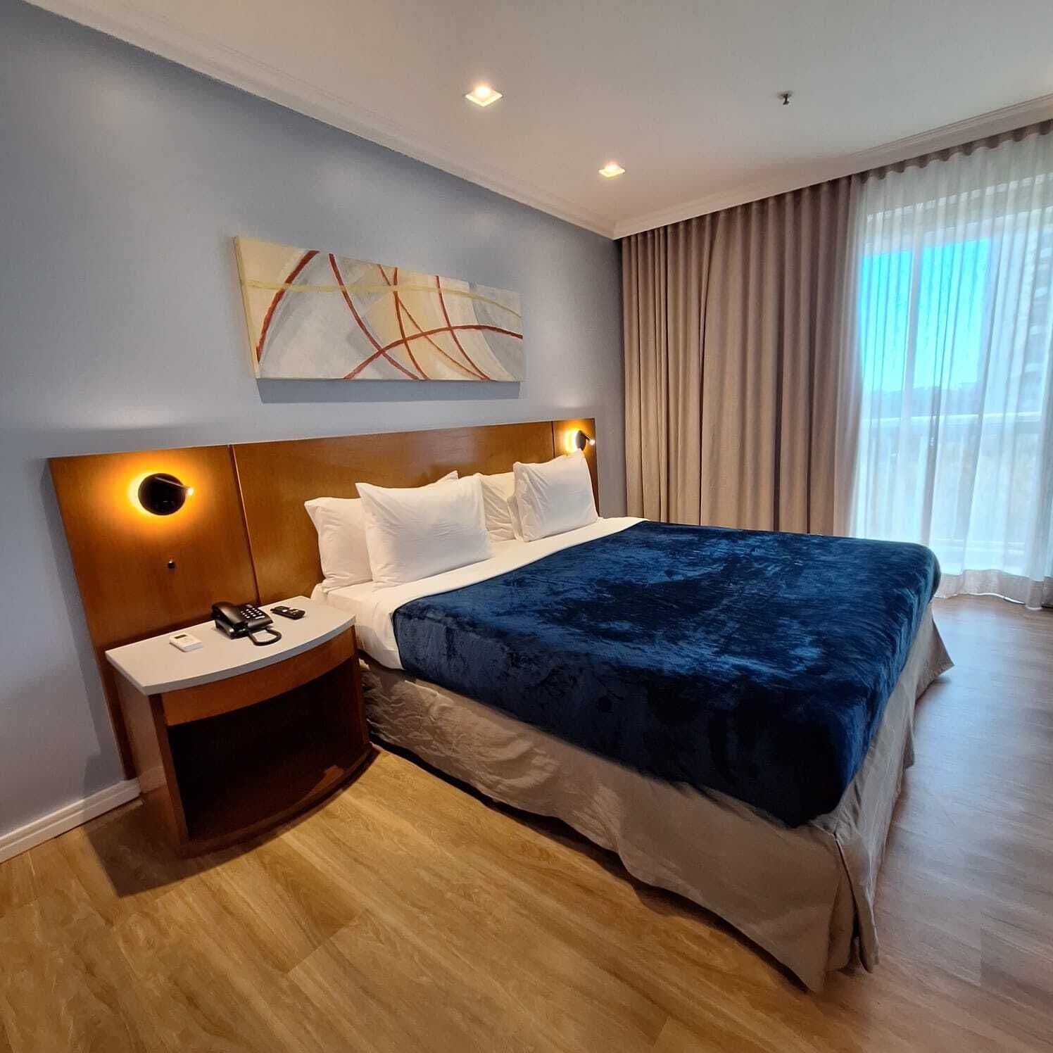 Superior Suite | 1 bedroom, in-room safe, blackout drapes, iron/ironing board