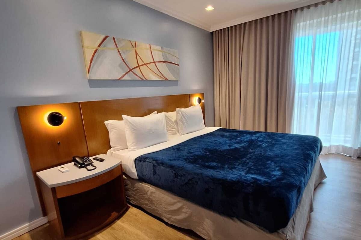 Superior Suite | 1 bedroom, in-room safe, blackout drapes, iron/ironing board