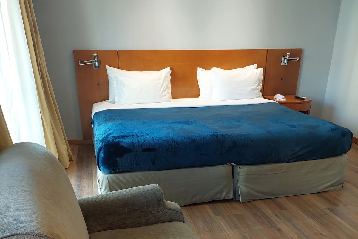 Standard Suite | 1 bedroom, in-room safe, blackout curtains, iron/ironing board