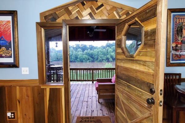 Step out from the living room and onto our delightful river view porch.