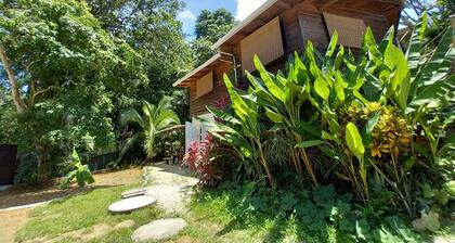 Chalet with jungle view deck on a river in lively Santa Teresa's surf town
