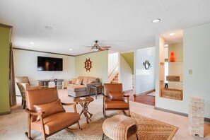 Smart TV, fireplace, table football, books