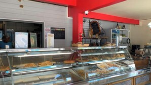 A bakery display case with various baked goods.