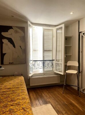 Enjoy a restful stay in this cozy room with a bay window, a comfortable bed, and a balcony.