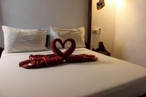 Hypo-allergenic bedding, down duvets, pillow-top beds, minibar