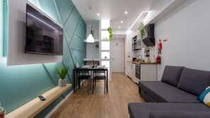 Superior Studio | Living area | 43-inch flat-screen TV with cable channels, Netflix, streaming services - The Jolie Apartments (Porto Moniz)