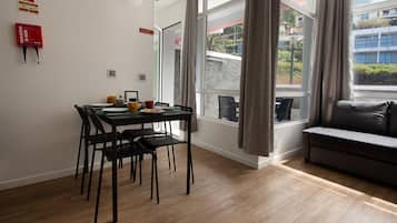 Design Apartment | Living area | 43-inch flat-screen TV with cable channels, Netflix, streaming services