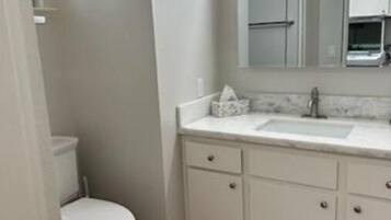 Shower, towels, soap, shampoo