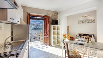 Fridge, microwave, stovetop, cookware/dishes/utensils