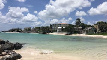 On the beach, sun loungers, beach towels