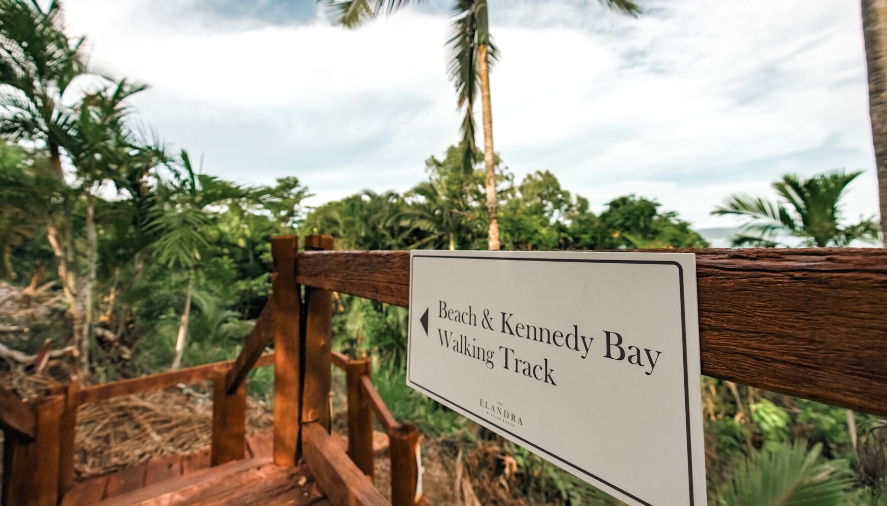 A sign for the Beach & Kennedy Bay Walking Track.