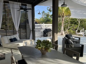 Outdoor dining - Canal waterfront home on Palm Island.  Less than 5 minute walk to the beach. (Placida)