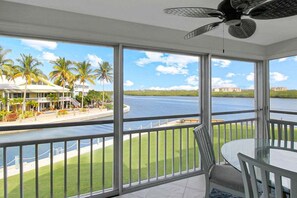 Outdoor dining - 2nd floor bayfront Siesta Key condo with beach access - GBB 1373 (Sarasota)