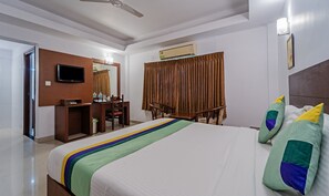 Standard Room | In-room safe, desk, iron/ironing board, bed sheets - Treebo Central (Thrissur)