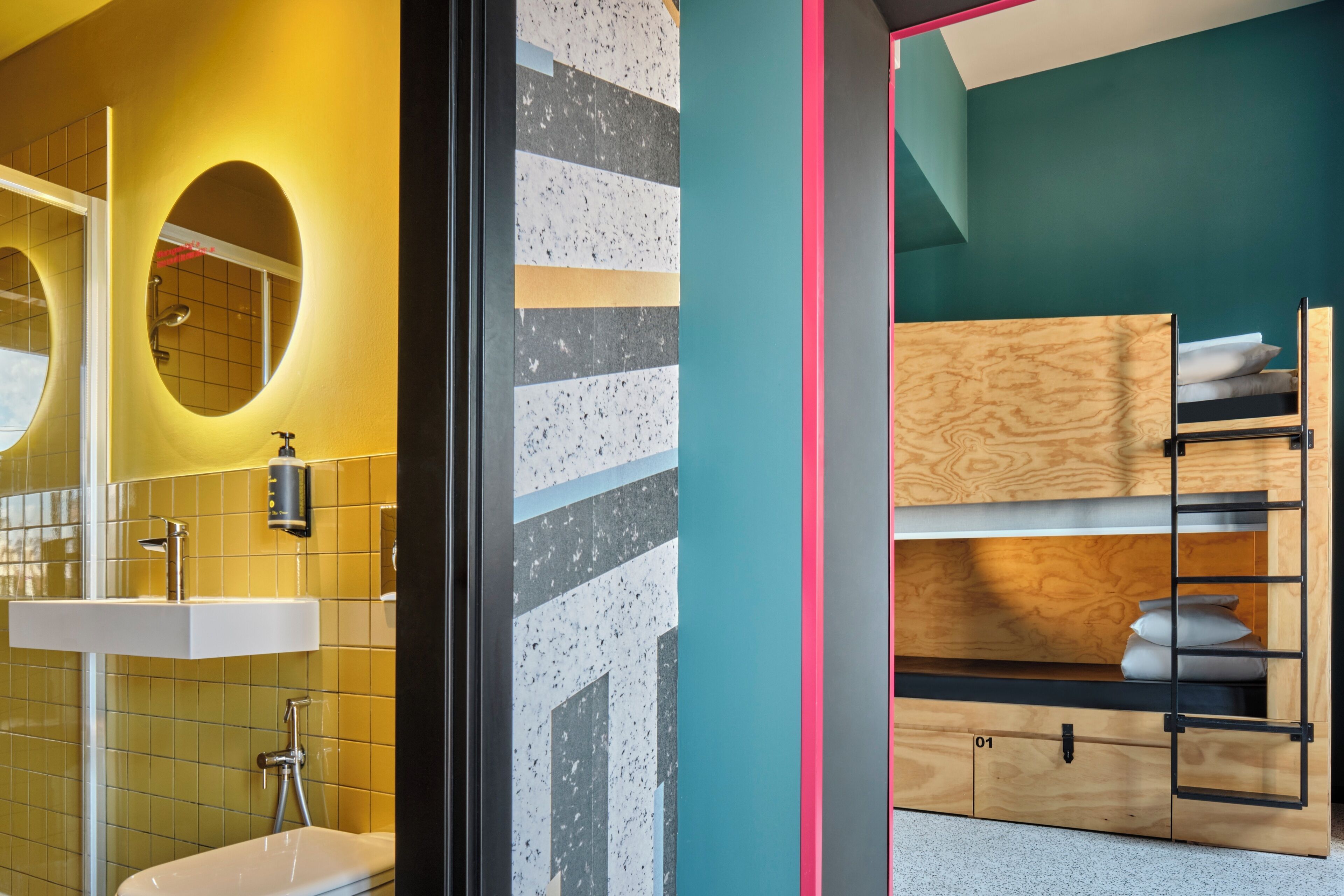A modern bathroom with a sink, mirror, and a bunk bed with storage.