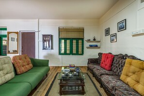 Living area - CosmicStays Kokiraj Lakehouse - Waterfront Retreat (Paud)