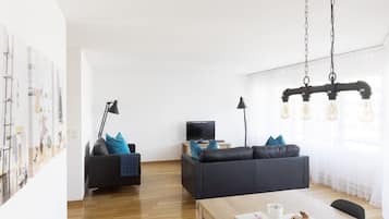City Apartment | Living area | 50-cm TV with digital channels