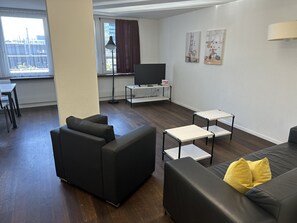 Family Apartment | Living area | 50-cm flat-screen TV with digital channels