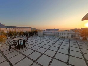Enjoy dining or socializing on the, tile-paved terrace with scenic views.