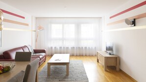 Apartamento City | Zona de estar