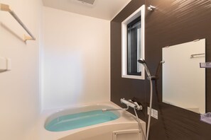 City Apartment | Bathroom | Separate tub and shower, hair dryer, slippers, bidet - The Premium Namba Minami  (Osaka)