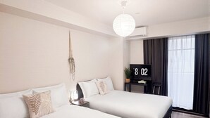 A hotel room with two beds, a desk, a TV, and a large window with curtains. - The Premium Namba Minami  (Osaka)