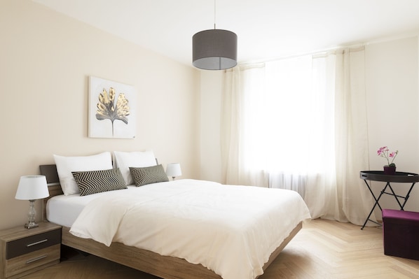 Premium bedding, desk, laptop workspace, iron/ironing board