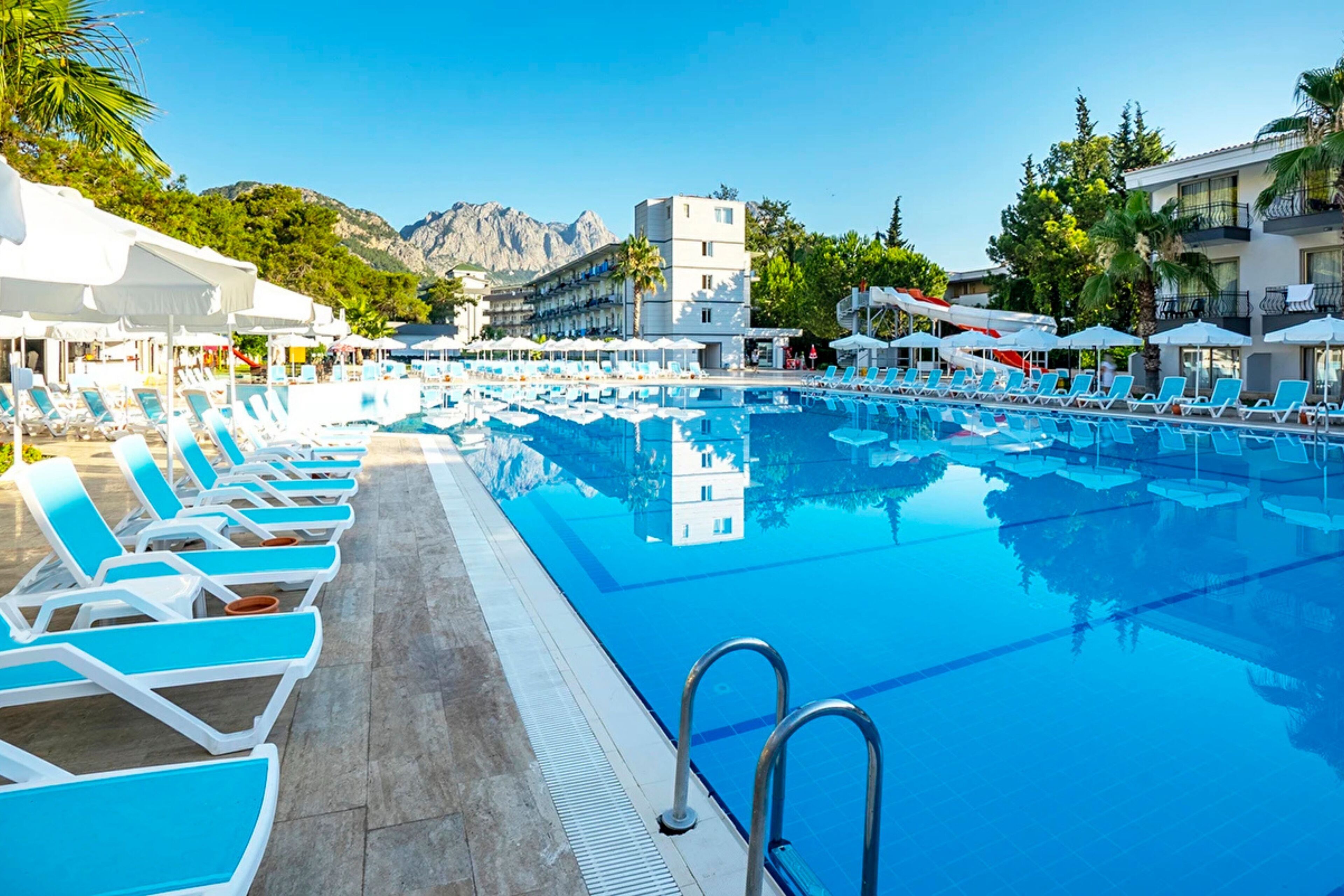 Seasonal outdoor pool, open 8:00 AM to 6:30 PM, pool umbrellas