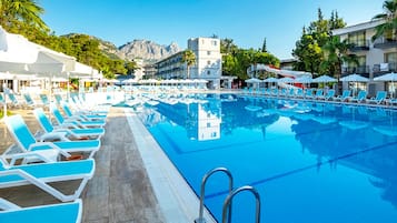 Seasonal outdoor pool, open 8:00 AM to 6:30 PM, pool umbrellas