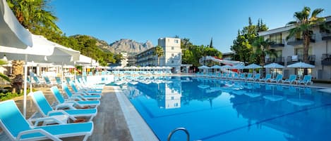Seasonal outdoor pool, open 8:00 AM to 6:30 PM, pool umbrellas
